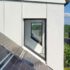 Dachgaube Mit Feststehendem Fenster Und PV-Anlage In Einem Vom Architekturbüro Eisenrbaun Geplanten Doppelhaus.